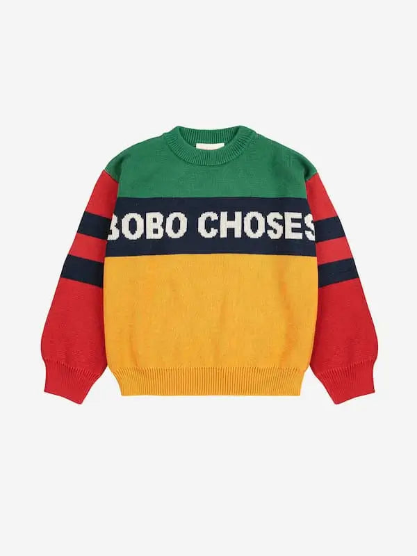 Jersey infantil Bobo Choses de manga larga en bloques verde, amarillo y rojo, con franjas azul marino en las mangas y logo en el pecho
