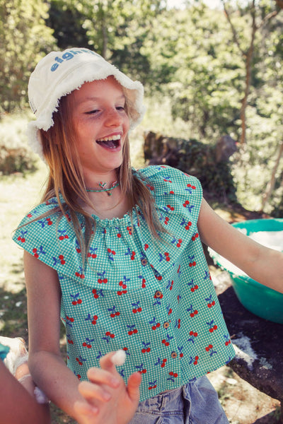 Camisa sin mangas con cuello l turquesa & blanco con estampado de cerezas Piupiuchick