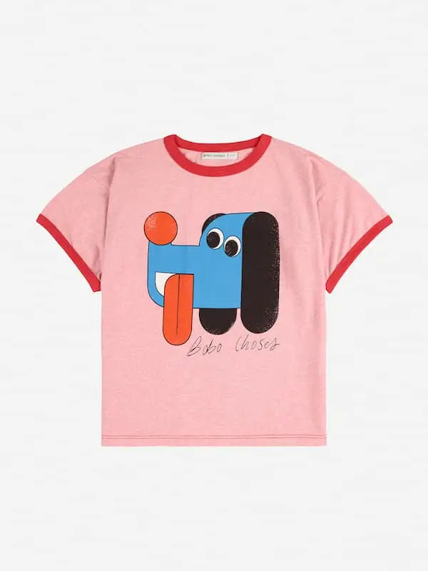 Camiseta rosa de Bobo Choses para niñas y niños con dibujo de perrito sacando la lengua.