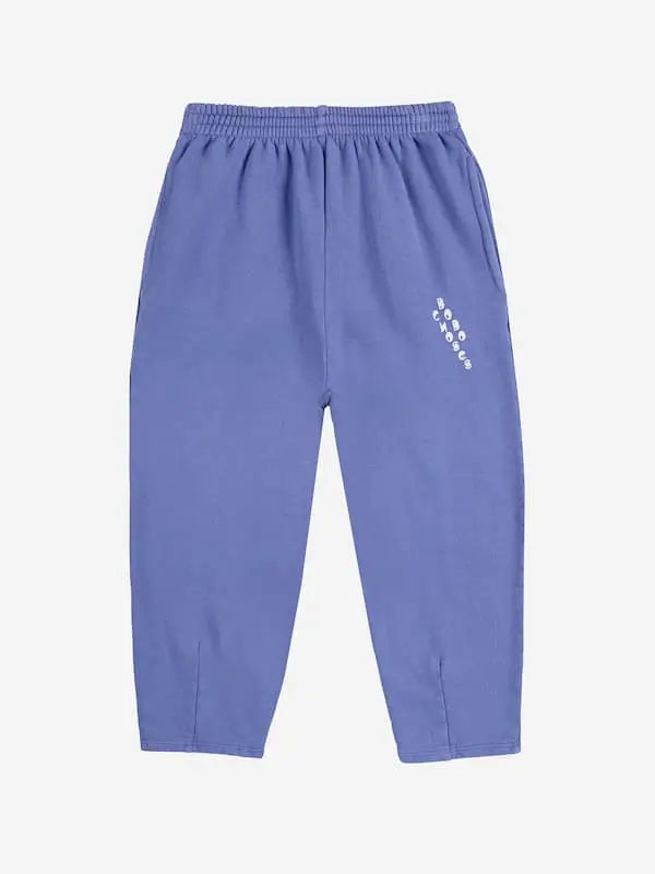 Pantalones jogging de Bobo Choses de color morado con logo en el bolsillo izquierdo para niñas y niños.