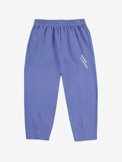 Pantalones jogging de Bobo Choses de color morado con logo en el bolsillo izquierdo para niñas y niños.