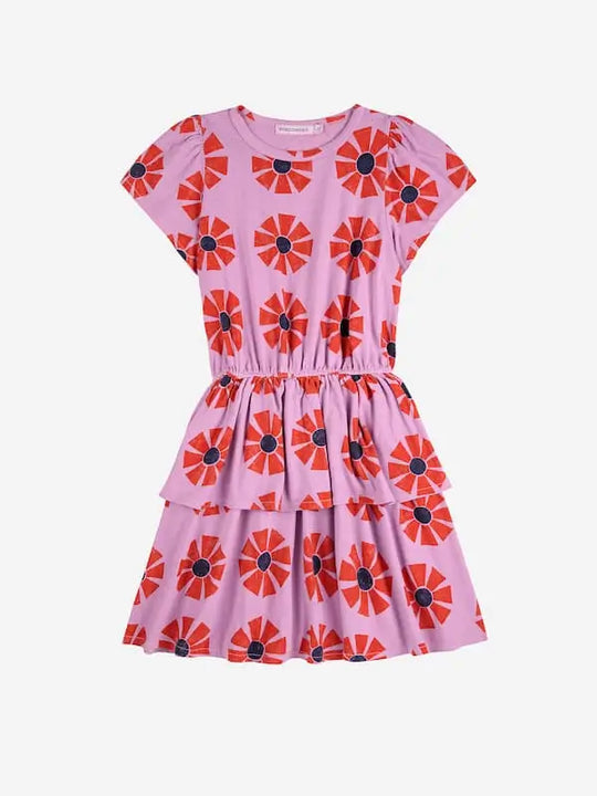 Vestido morado de algodón de manga corta con estampado de caleidoscopios y volante en la cintura, Bobo Choses, vista delantera.