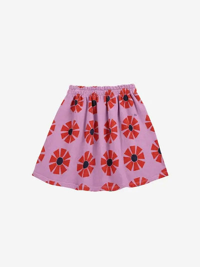 Falda corta de color morado con estampado de caleidoscopios rojos y logo BC bordado.