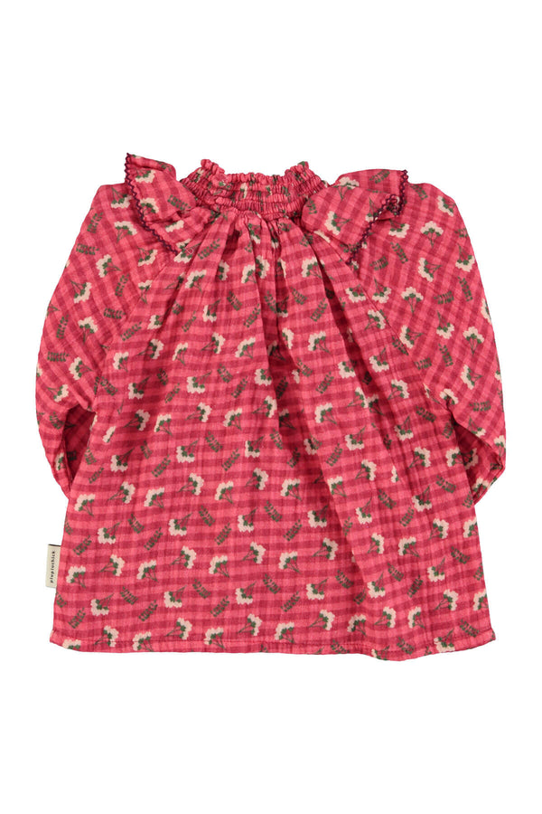 Vista atras de blusa rosa con estampado de flores para niñas de Piupiuchick para otoño invierno 2025 moda sostenible.