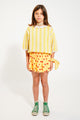 Falda corta amarilla de rizo con estampado de lazos rojos Piupiuchick