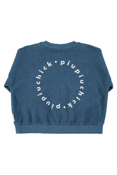 Vista trasera de sudadera azul con logo en la espalda para niñas y niños de Piuiuchick.