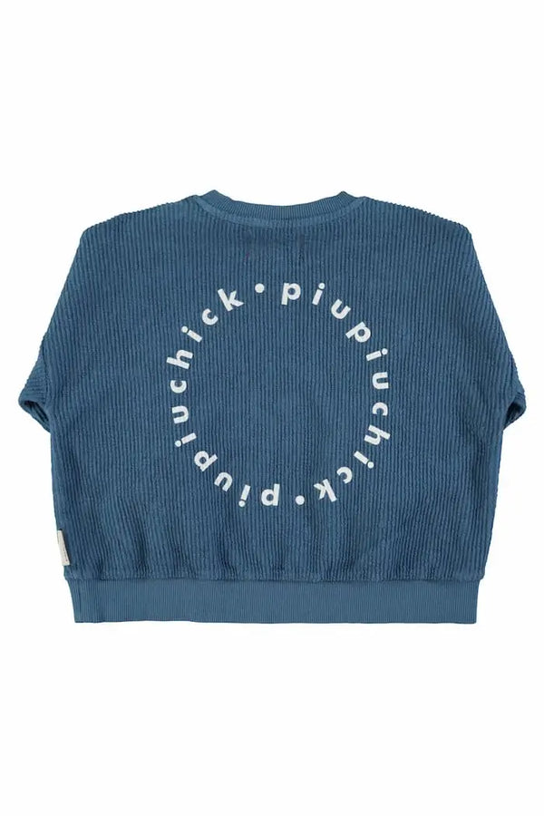 Vista trasera de sudadera azul con logo en la espalda para niñas y niños de Piuiuchick.