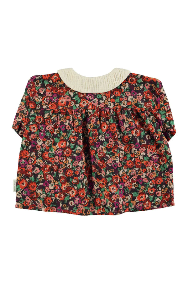 Vista atrás de blusa de flores multicolor y cuello Peter Pan de Piupiuchick AW25 I'm with the band 