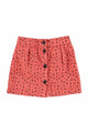 Falda corta de color rosa con estampado de flores negros para niñas de Piupiucick.