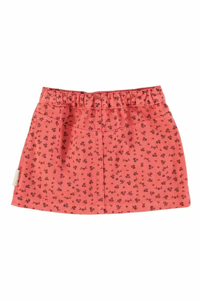 Falda corta rosa con estampado de flores pequeños negros de Piupiuchick- vista atrás.