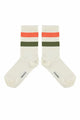 Calcetines de color crudo con dos rayas, una verde, otra naranja de Piupiuchick.