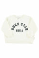 Sudadera  unisex de color crudo con texto "Hug a rock star" en negro e la parte delantera de Piupiuchick.