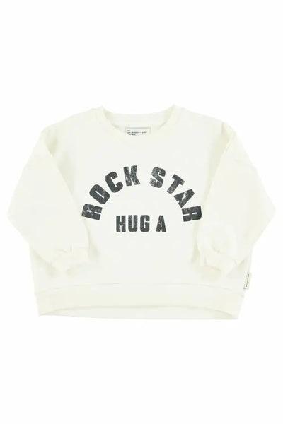 Sudadera  unisex de color crudo con texto "Hug a rock star" en negro e la parte delantera de Piupiuchick.