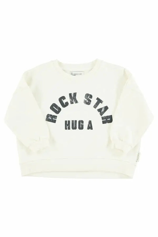 Sudadera  unisex de color crudo con texto "Hug a rock star" en negro e la parte delantera de Piupiuchick.
