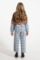 Niña con pantalón de cuadros de Piupiuchick