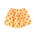 Falda corta amarilla con estampado de lazos rojos para niña Piupiuchick